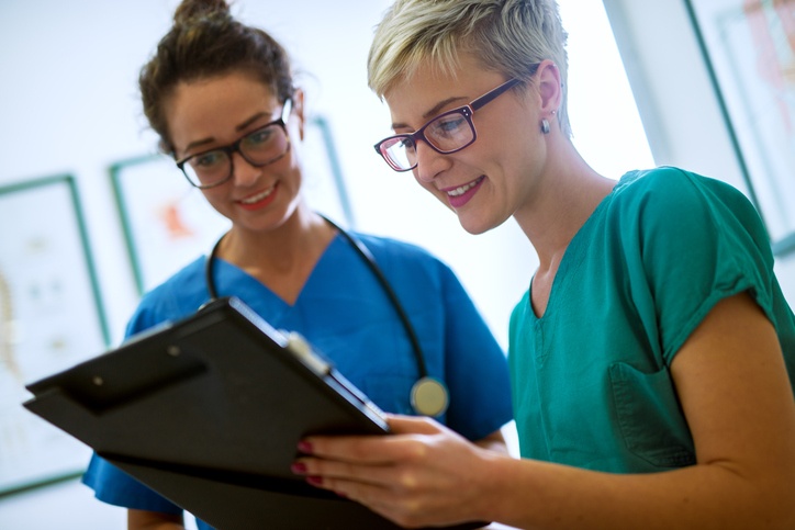 two nurses reviewing charts